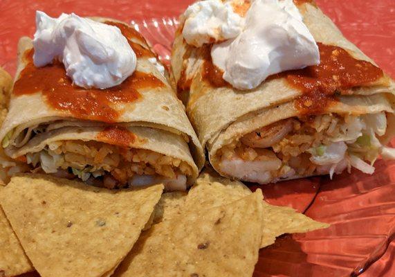 Shrimp Burrito with cabbage, rice and white sauce. I topped it with spicy red sauce and sour cream.