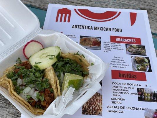 One pastor and one carne asada taco.