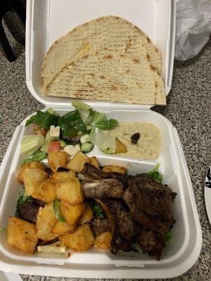 Lamb chop plate with spicy potatoes and baba ghanoush, I added the salad because the feta looked so delicious.