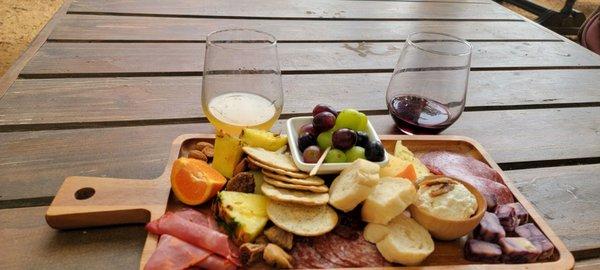 Charcuterie board, sangria, and red wine