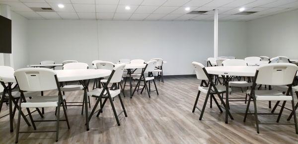 Event room with table and chairs.