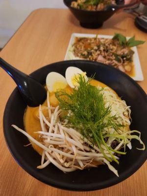 Khao Poon (rice noodles in red curry broth)