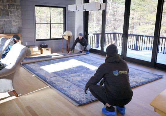 Placement of a beautiful blue rug at a new construction for our Interior Design partner!