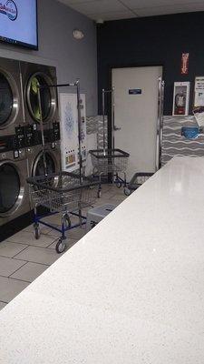 Carts were in front of the dryers. There were many strewn about.