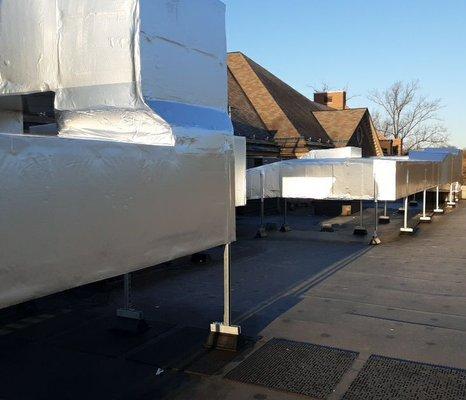 Port Chester High School. Installed Carlisle SynTec Systems .060 Sure Seal EPDM on nine flat roofs.