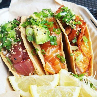 Taco Trio: ahi poke, salmon poke + crispy salmon. Dressed w/ house spicy mayo or creamy garlic sesame (non- spicy).