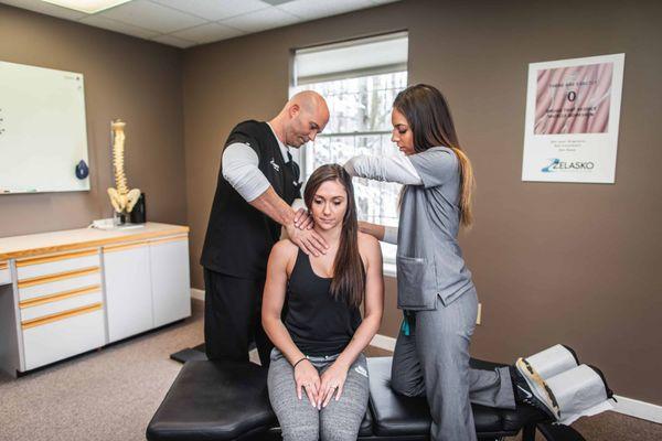 Dr. Zelasko and Medical Assistant treating patient