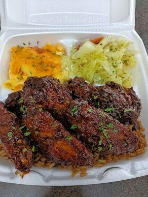 Jerk wings  Coconut beans and rice  Baked Mac and cheese  Steamed cabbage