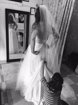 Pinning a bustle for a bride