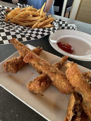 Cheesesteak egg rolls and fries