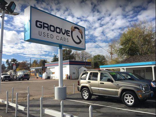 Groove Used Cars sign off of Broadway looking West