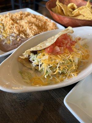 Shredded beef hardshell taco, al cart. Really good, full of flavor.