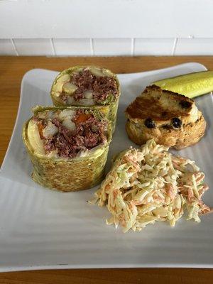 Irish wrap with corn beef, potatoes, carrots, mustard with side of slaw and soda bread.