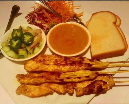 Chicken Satay with peanut sauce and delicious Cucumber, onion, jalapeno relish.