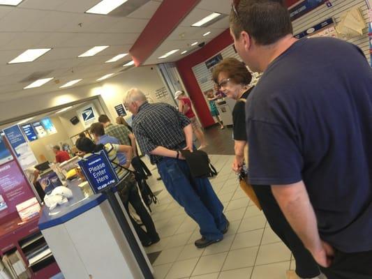 Typical midweek idiotically long line at the worst post office in the history of the world.