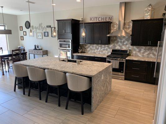 Waterfall granite edge makes this kitchen pop