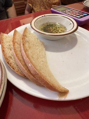 Half of the bread and oil. We couldn't resist digging in.