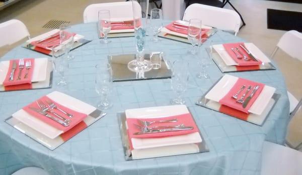 Tiffany Blue table linen with modern square plates and melon napkins.