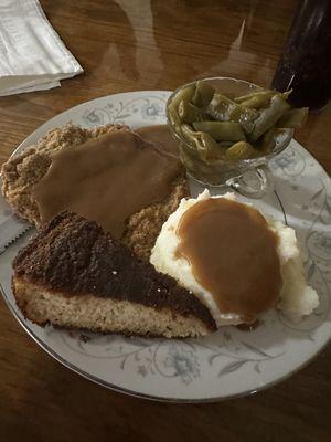 Country fried steak with mashed potatoes and green beans