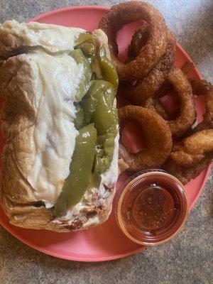 Beef sandwich.. dipped... marinara on the sandwich and the side.  Mozzarella and sweet peppers  Onion rings to die for!!!