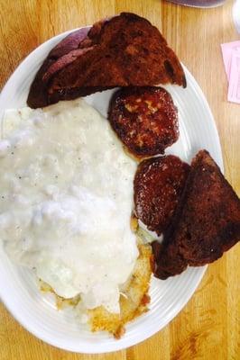 Potato pancakes with sausage gravy and 2 over easy eggs plus sausage patties......very greasy breakfast