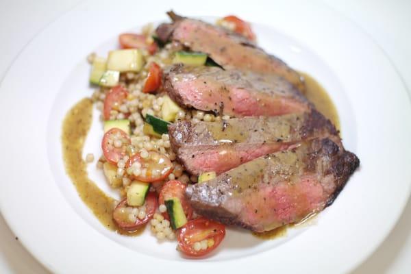 Seared flank steak with couscous salad