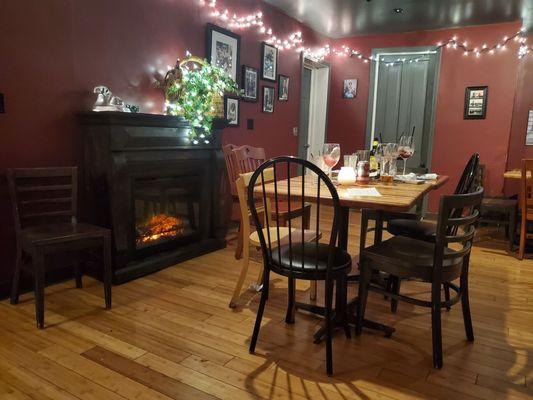 Fire place and one of the dinning areas.