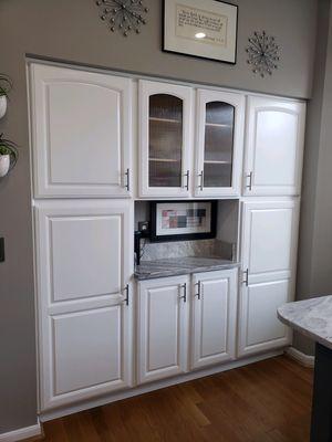 Painted cabinets with new glass with inserts.