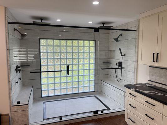 Custom shower with pivot hinges & header