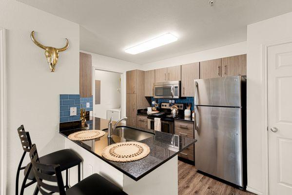 The Lodge Unit Kitchens: Stainless Steel Appliances, Gradient CounterTops, and Sitting Area.