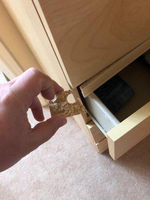 piece of the chest of drawers broke off.