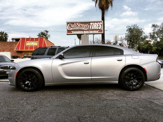 2017 Dodge Charger ok hellcat wheels wrapped with falken tires on staggered fitment.