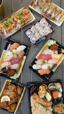 Birdseye view of lunch platter and sushi items