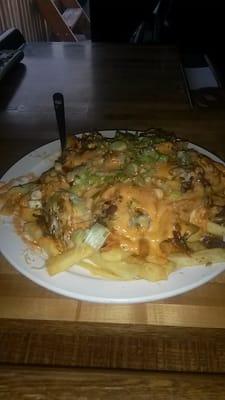 Kimchee fries! Fries.civered with cheese, homemade kimchee, thin sliced beef and scallions! Absolutely delicious!