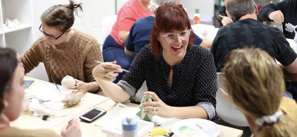 Pottery Parlor: friends hanging out and having fun while they paint their own pottery