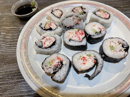 Buffet sushi. California rolls with two types of wrapping style.