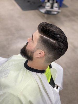 One fade with shear work on top, and tapered neck line. fresh beard trim.