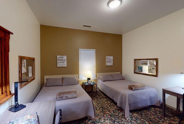 Cozy double room where members may stay in during their detox or inpatient addiction treatment at Sana Lake Recovery.