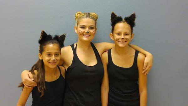 Briana and Natalie with Miss Stephanie during Halloween class time