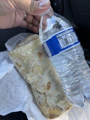 Machaca Burrito with added hash browns size compared to Kirkland water bottle.