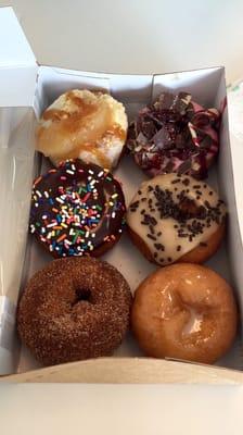 Cinnamon sugar, glazed, chocolate frosted with sprinkles, maple frosted with sprinkles, apple pie, and raspberry chocolate