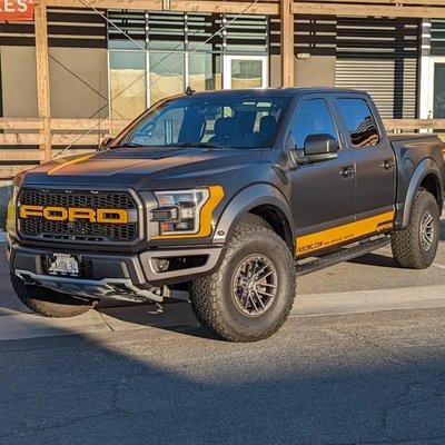 Ford Raptor wrap in satin black with yellow accents