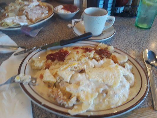 Biscuits and gravy with potatoes and two eggs fried hard on top.  Could've been hotter but still good!