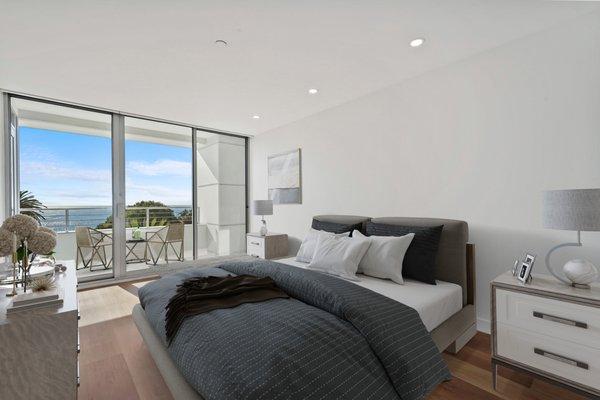 Bedroom leads to balcony with ocean view