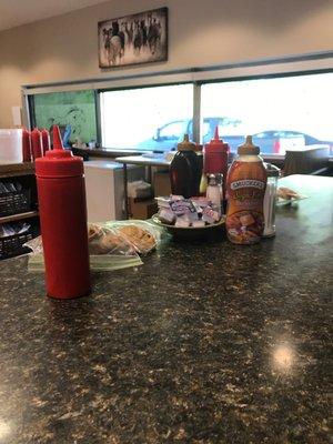 Look! There are condiments on our eating area! (Barflies)