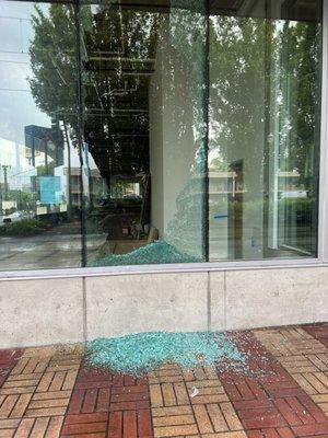 This broken glass sat on the floor for weeks. Just a smashed window beside the front entrance.