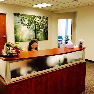 Julia working at Naperville office reception area