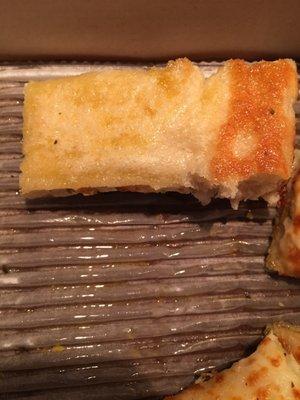 Cheese bread was underdone in the middle too and swimming in butter.