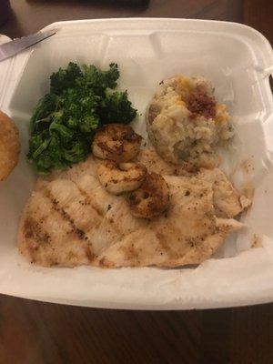 Chicken and shrimp with broccoli and mashed potatoes.