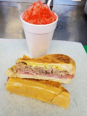 a cuban sandwich paired with a cherry shaved ice!